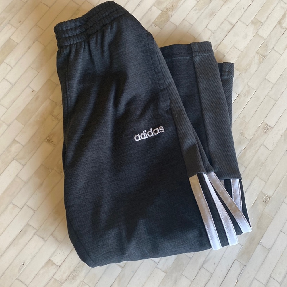 Adidas sweatpants.